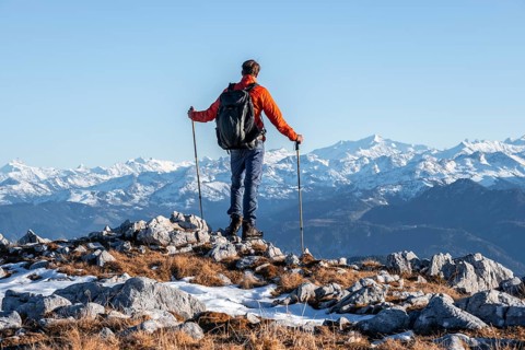 Mountaineer in front of mountain panorama