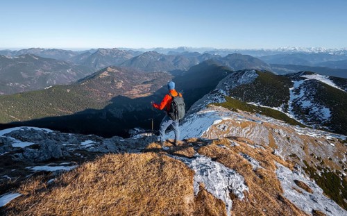 Climbers on the summit ridge with first snow in autumn