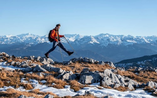 Mountaineer taking a big step
