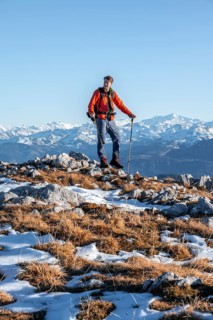 Mountaineer in front of mountain panorama