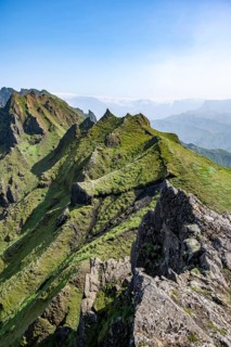Pointed green mountain peaks on the ridge of Tindfjoell