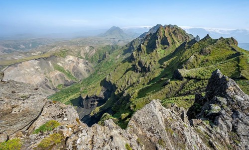 Pointed green mountain peaks on the ridge of Tindfjoell
