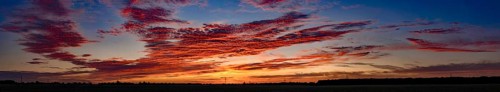 Sunset with red coloured clouds on the evening of the solstice