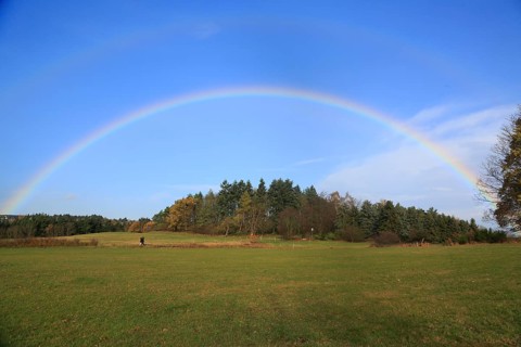 Rainbow over field and woodland near Eschweiler