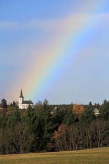 Rainbow over field and woodland near Eschweiler