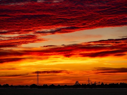 Sunset with red coloured clouds on the evening of the solstice