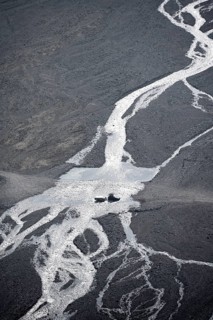 Car crossing river at a ford