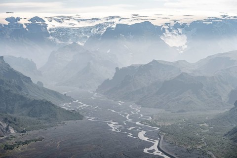 View into mountain valley with glacier river Krossa and glacier Myrdalsjoekull