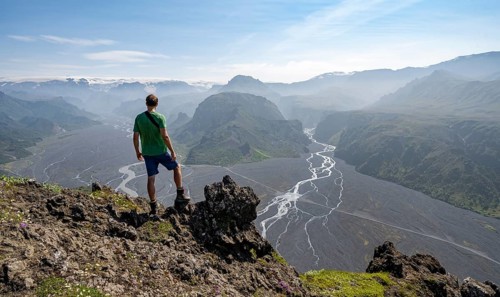 Hikers in front of mountain landscape