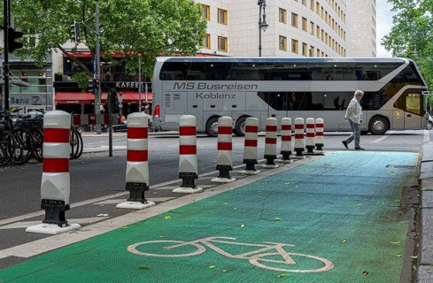 Bicycle lane with green marking and safety bollards