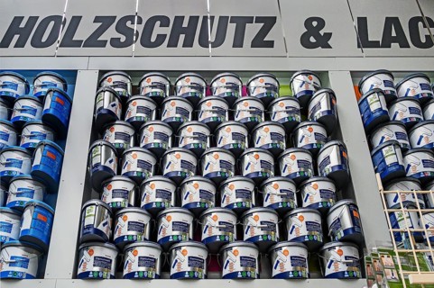 Stacked paint buckets with premium white in a DIY store