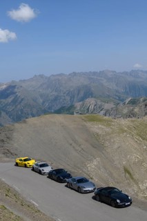 View of five Porsche sports cars on 2802 metre high mountain road