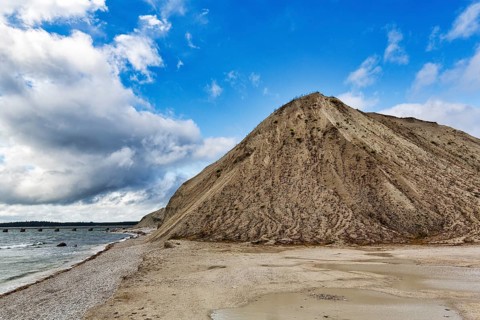Gravel beach and spoil heap
