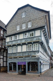 Half-timbered house with slate shingles in the old town