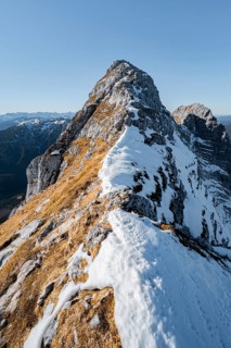 Summit ridge with first snow in autumn