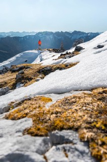 Mountaineer next to a cairn