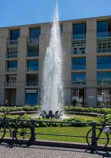 Water fountain on Pariser Platz in front of a DZ Bank branch