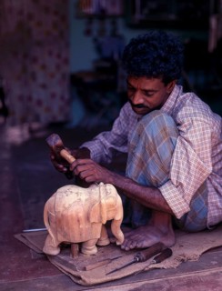 A craftsman with his sandalwood elephant in Mysuru or Mysore