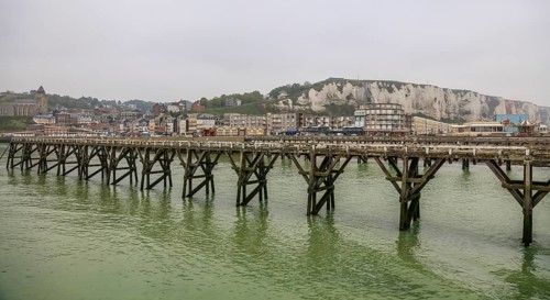 Coastal village of Le Treport at the mouth of the Bresle on the English Channel with Europe's highest chalk cliff and Saint-Jacques church