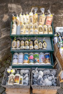 Candles in front of a devotional shop at Kapellplatz