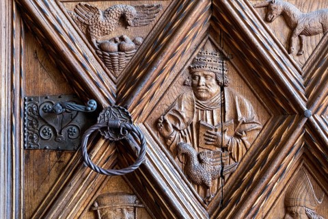 Richly decorated wooden portal of the collegiate parish church of St. Philip and St. James