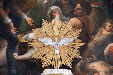 Pentecost dove in front of the altarpiece in the high altar of the collegiate parish church of St. Philip and St. James in Altoetting