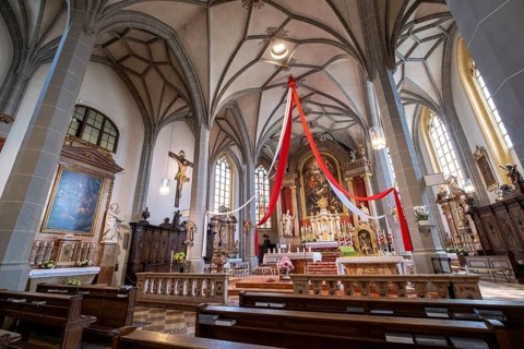 High altar of the collegiate parish church of St. Philip and St. James in the pilgrimage town of Altoetting. On the right