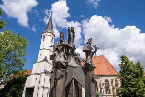 Fountain in front of the collegiate parish church of St. Philip and St. James in the pilgrimage town of Altoetting. The fountain was erected to mark the 1250th anniversary of the establishment of the ...