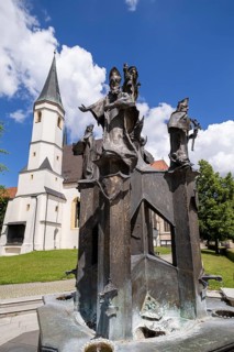 Fountain in front of the collegiate parish church of St. Philip and St. James in the pilgrimage town of Altoetting