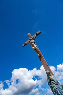 Figure of the Virgin Mary on a wooden cross with crucifix at the St. Michael cemetery