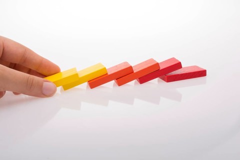 Colorful Domino Blocks in a line on a white background
