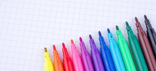 Colorful felt-tip pens on a notebook