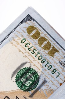 American 100 dollar banknotes made of paper placed on white background