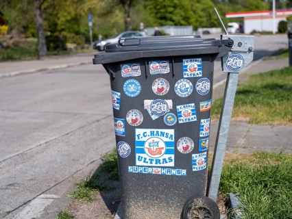 Bin with stickers of football fans and Ultras of FC Hansa Rostock at the motorway service station Hardtwald West