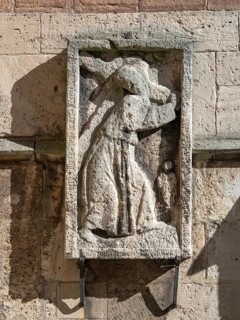 Stone relief of Christ carrying the cross on the facade of Brunswick Cathedral