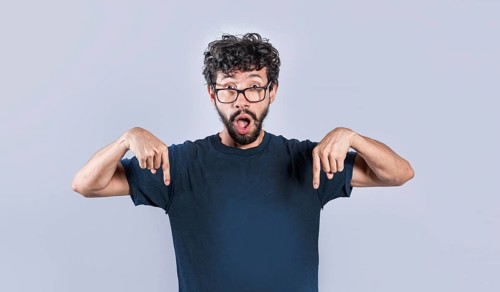Amazed man pointing down isolated, Shocked person pointing down with fingers isolated