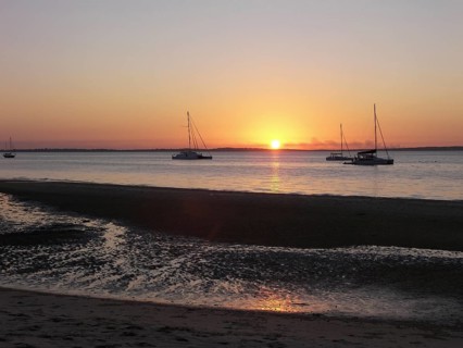 The sun sinks into the Pacific Ocean in a westerly direction, Fraser Island