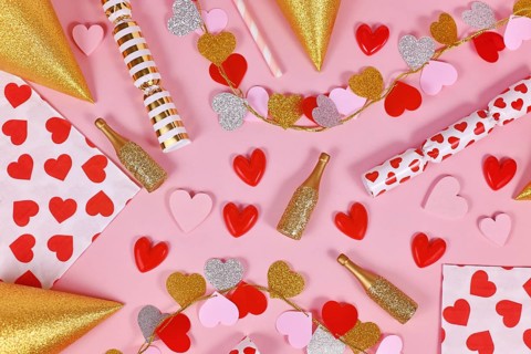 Party flat lay with heart garland, napkin