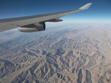 View from the plane of the inhospitable mountainous country in the region of Afghanistan, Pakistan