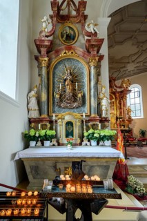 Side altar with figure of Mary and sacrificial candles, St. Verena parish church