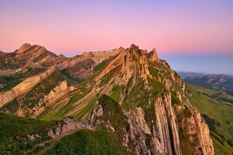 View of the Alpstein mountains in Appenzell, cloudless sky in the morning light