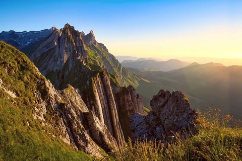 Alpstein mountains with ridge in the evening light, cloudless sky over Appenzellerland