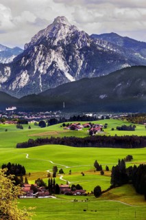 The Saeuling 2047 m and green meadows near Fuessen, Allgaeu