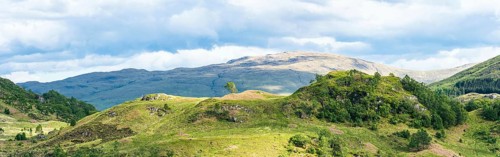 Panorama of Mountains in Lights and Shadows over Glenfinnan Viaduct, West Highland Line in Glenfinnan