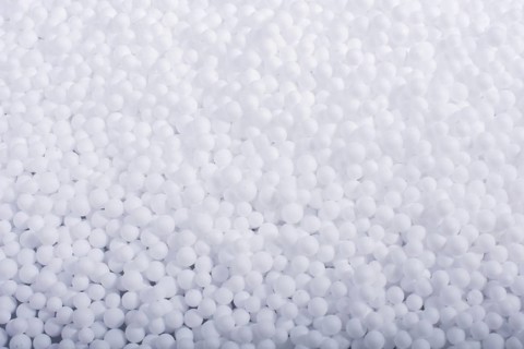 White little polystyrene foam balls as background,