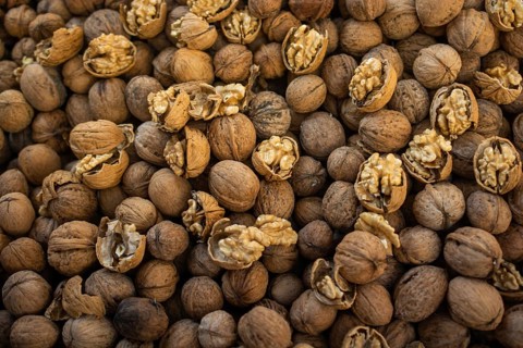 Whole walnuts background. Healthy organic food concept,