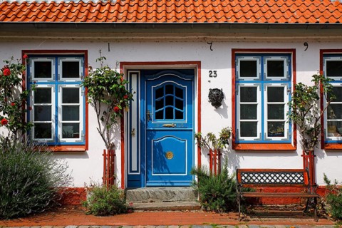 Old fisherman's house from 1796 with decorative wooden door, Historic fishing settlement Holm