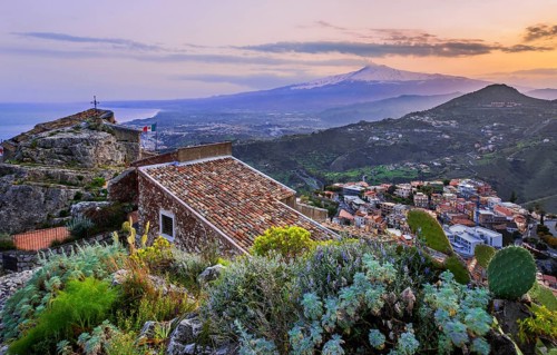 Chapel Madonna della Rocca above the village with Etna 3357m at dusk, Taormina