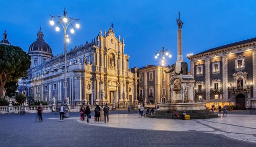 Cathedral square with cathedral and elephant fountain in the old town at dusk, Catania