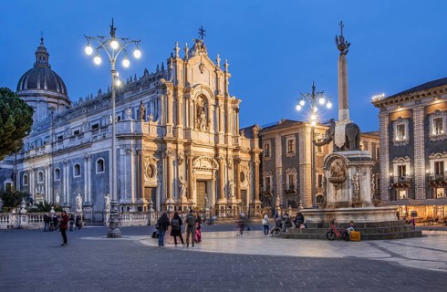 Cathedral square with cathedral and elephant fountain in the old town at dusk, Catania